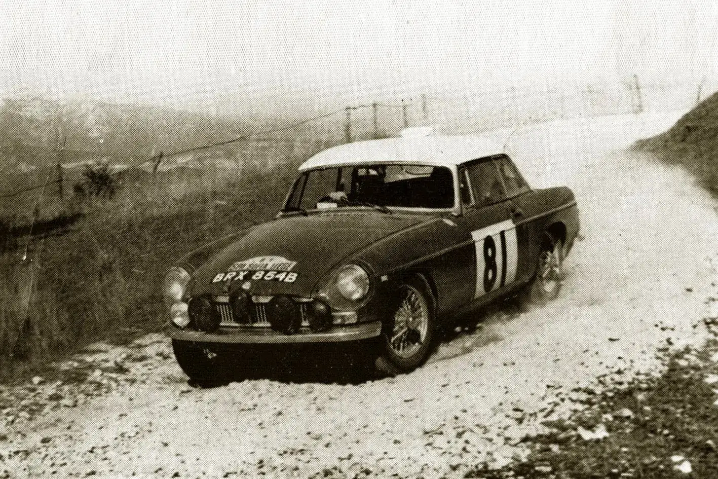 A classic MG competing on a gravel rally stage, archive photograph
