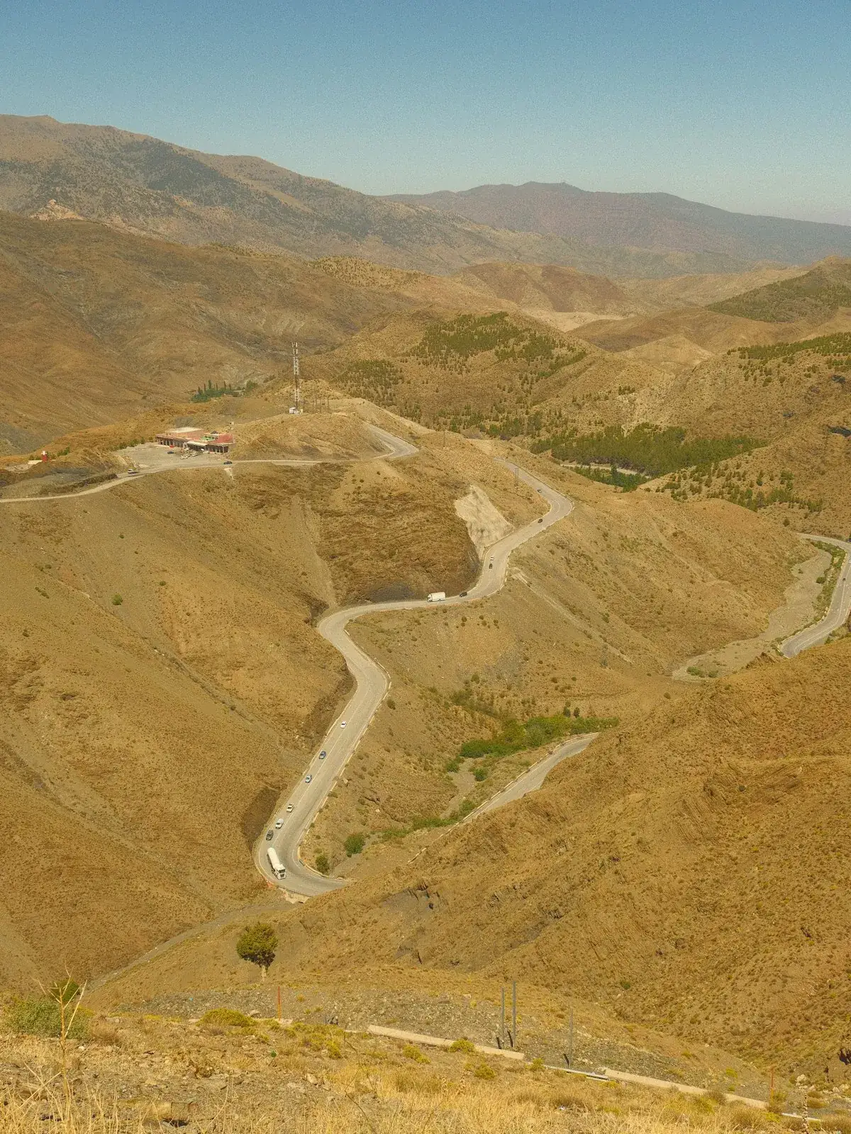 A road winding through the arid folds of the Atlas