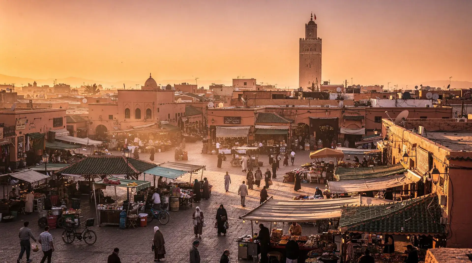 Marrakech at dusk with the Koutoubia minaret against a warm sky